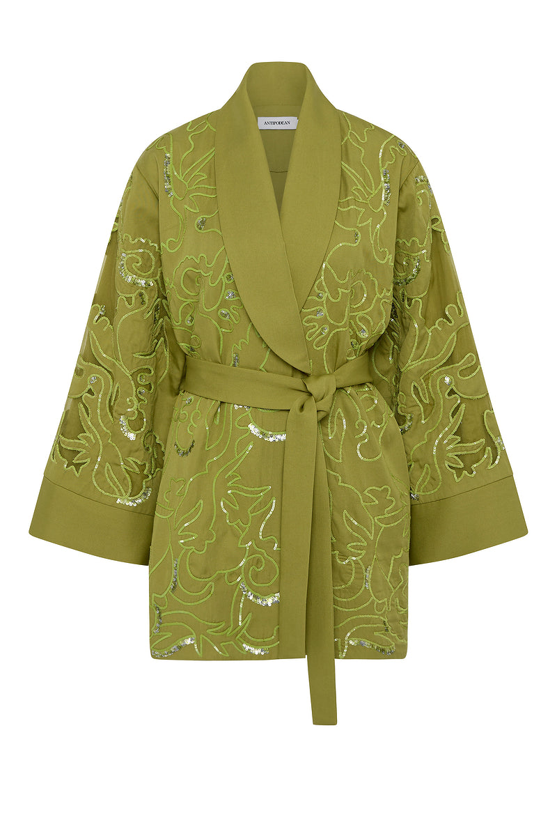 Green embroidered robe on a white background